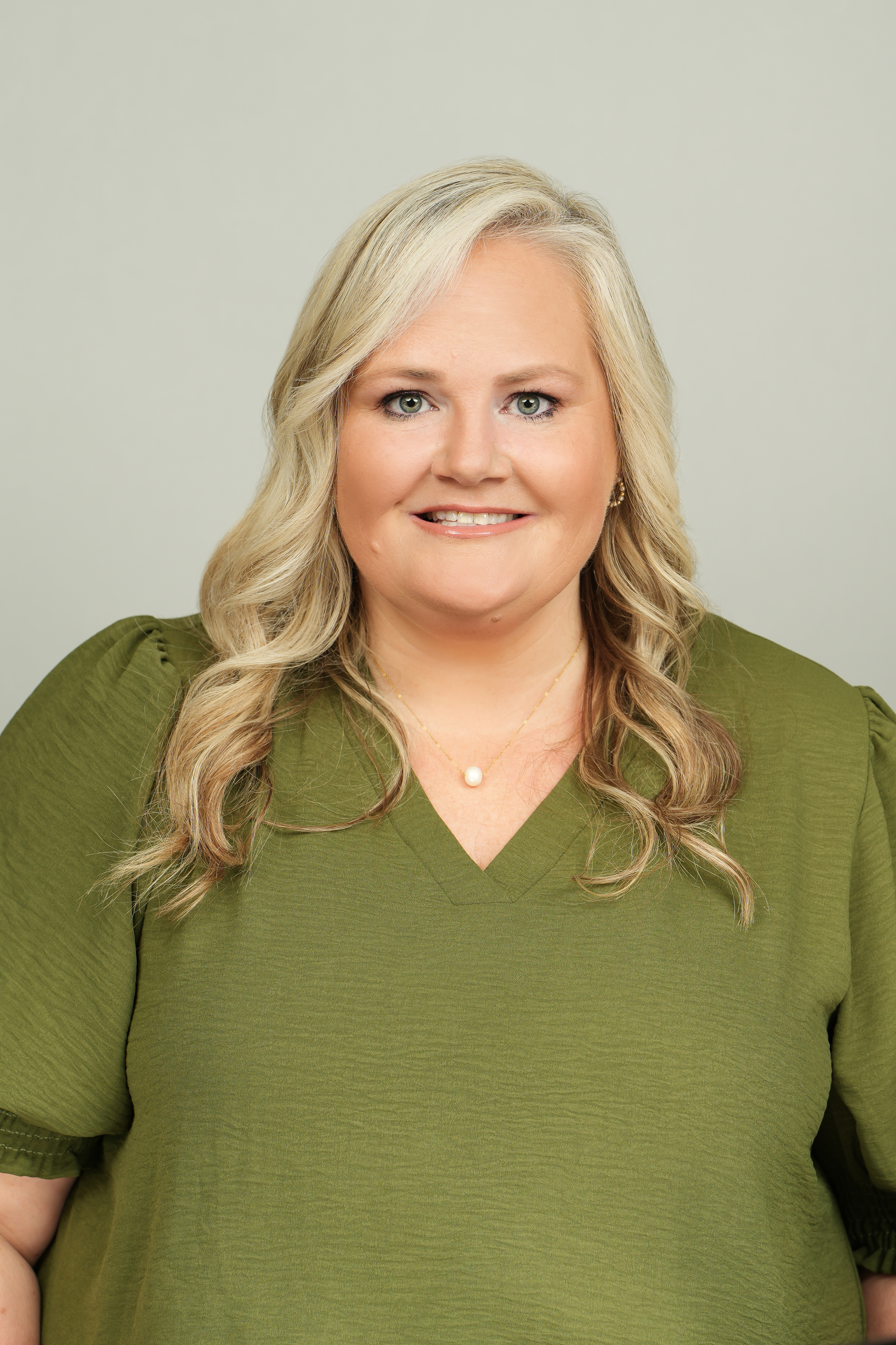 Professional headshot of Sheena Tinsley, Sullivan County Register of Deeds, wearing a green blouse.