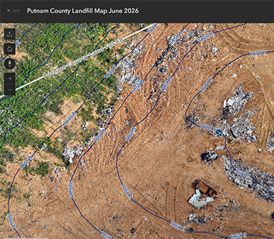 Aerial landfill map with contour lines over a dirt disposal area and surrounding vegetation.